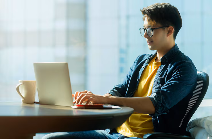 Student studying online on a laptop